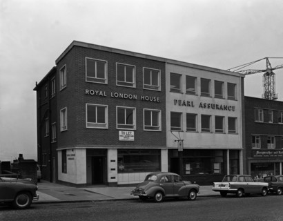 Morris Minor and a Triumph Herald outside the Royal Insurance Building, Rotherham, S Yorks, 1962. Artist: Michael Walters
