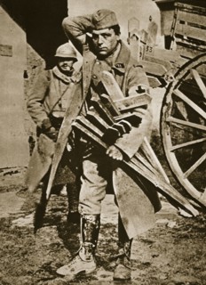 French soldier with wooden crosses to be placed on temporary graves, World War I, c1914-c1918. Artist: Unknown