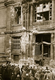 A crowd of men gathered in front of a ruined building, Germany c1918-c1919(?) (1936) Artist: Unknown