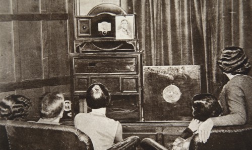 People watching an early television transmission, c1920s. Creator: Unknown.