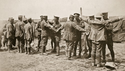 British soldiers searching captured German prisoners, Somme campaign, France, World War I, 1916. Artist: Unknown