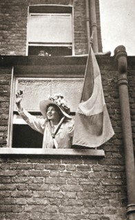 Christabel Pankhurst waving to the hunger strikers from a house overlooking Holloway Prison, 1909. Artist: Unknown