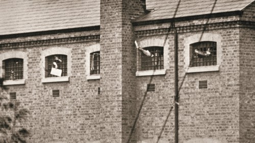Hunger strikers waving to Christabel Pankhurst from their cells in Holloway Prison, London, 1909. Artist: Unknown