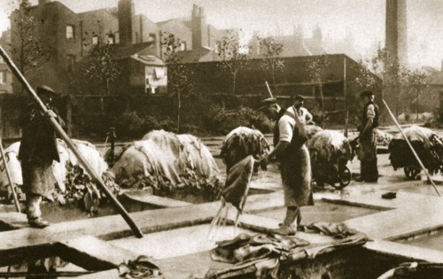 Making leather in the lime yard at Neckinger Mills, London, 20th century. Artist: Unknown