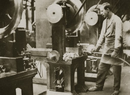 Money making; cutting strips of silver into disks, 20th century. Artist: Unknown