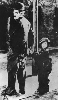 Charlie Chaplin and Jackie Coogan in 'The Kid', 1921. Artist: Unknown