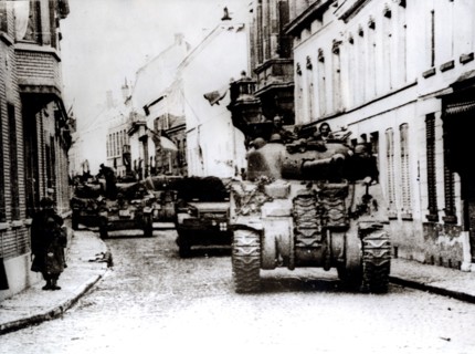 Polish tanks advance through the town of Tielt, Belgium, c1944. Artist: Unknown