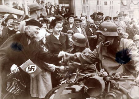 German troops are greeted by a crowed in Luknov, Czech Republic, c1939. Artist: Unknown
