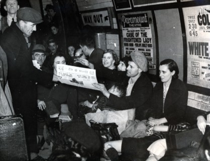 Paper seller down in the underground, London, c.1940. Artist: Unknown