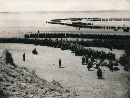 British and French troops wait on the dunes to be evacuated, Dunkirk, 1940. Artist: Unknown
