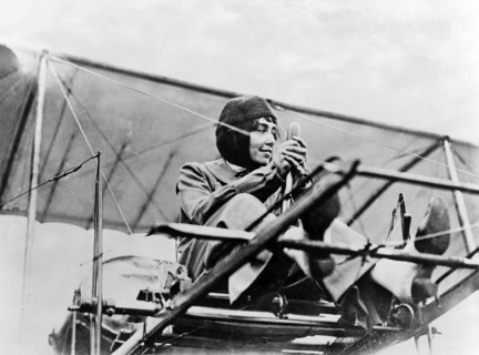 Hélène Dutrieu at the controls of her plane, c.1911.