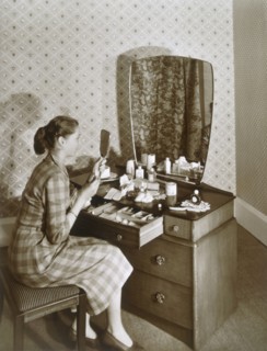 Woman at her dressing table, c1955. Creator: English Photographer (20th Century).