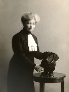 Alexandra Beketova-Blok, Russian author and translator, with her pet dog, early 19th century. Artist: Karl August Fischer