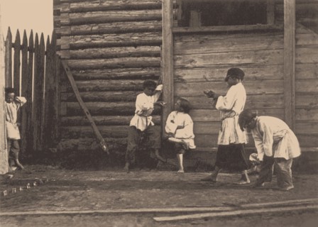 Boys playing Knucklebones, 1860s.
