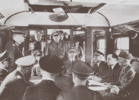 The German and French delegations inside a railroad car at Compiègne for the signing of France's sur Artist: Anonymous