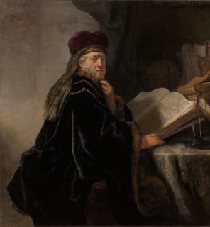 A Scholar Seated at a Desk (Scholar at his Study). Artist: Rembrandt van Rhijn (1606-1669)