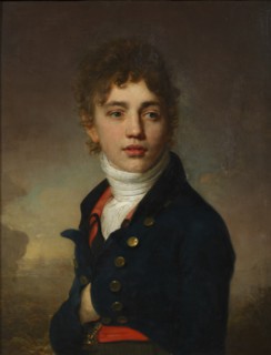 Portrait of a boy wearing a red waistcoat.