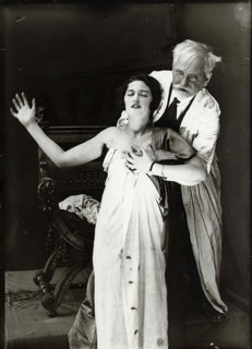 Alphonse Mucha and Jaroslava posing for poster DeForest Phonofilm, 1927.