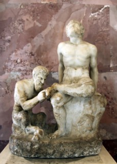 Pan and satyr, Pan removing a splinter from a satyr's foot. Artist: Unknown