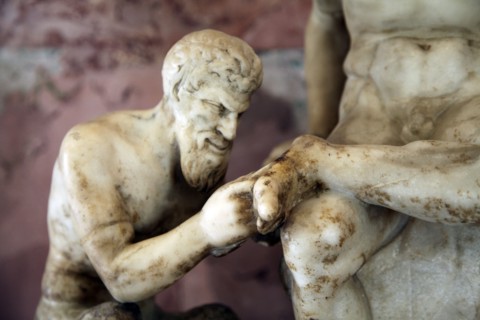 Pan and satyr, Pan removing a splinter from a satyr's foot. Artist: Unknown