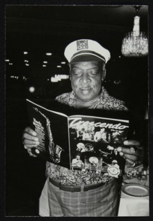 Count Basie reading a copy of Crescendo magazine at the Grosvenor House Hotel, London, 1979. Artist: Denis Williams