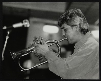 Dick Pearce playing the flugelhorn at The Fairway, Welwyn Garden City, Hertfordshire, 1999. Artist: Denis Williams