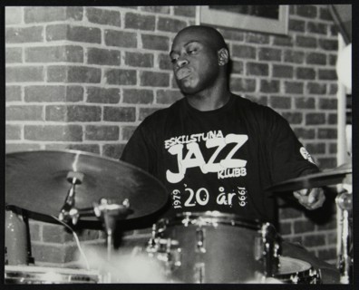 Winston Clifford on drums at The Fairway, Welwyn Garden City, Hertfordshire, 18 February 2001. Artist: Denis Williams