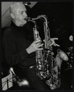 Kelvin Christiane playing two saxophones at The Fairway, Welwyn Garden City, Hertfordshire, 2002. Artist: Denis Williams