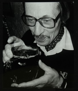 Tom Burnham with a pint at The Bell, Codicote, Hertfordshire, December 1986. Artist: Denis Williams