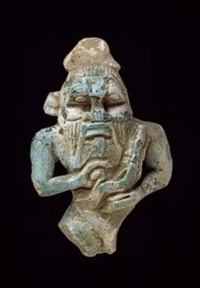 Faience amulet of Bes nursing a Horus, XXVth Dynasty (c770 BC-c715 BC). Artist: Unknown.