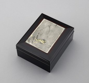 Box with plaque depicting a duck swimming past reeds, probably before 1908. Artist: Ikkoku Kajima.