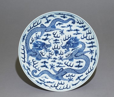 Blue-and-white dish, dragons chasing a flaming pearl, Qing Dynasty, Guangxu Period (1875 - 1908)) Artist: Unknown.