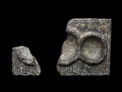Libation table fragment; corner and part of two circular receptacles, c2325-c2175BC.. Artist: Unknown.