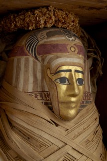 Ptolemaic coffin, mummy with gilt mask and floral garlands, Roman Period (Egypt), c30BC-AD641. Artist: Unknown.