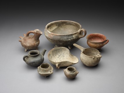 Small open mouth vessel with extended ledge and 2 handles around the body. Artist: Unknown.