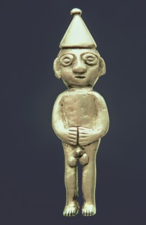 Anthropomorphic figure made of silver representing a male person standing with his hands on the b?