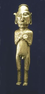 Empty anthropomorphic figure made of silver representing a male person with his arms across his c?