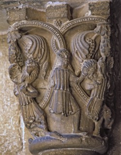 Capital decorated with the Good Shepherd with two figures on each side carrying a lamb and wolves?