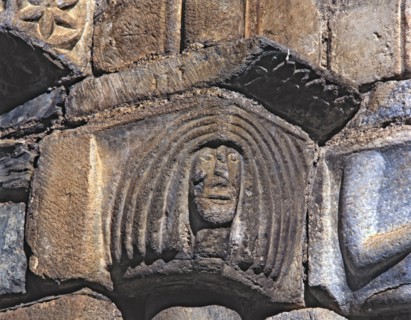 'Female Head', capital of the façade of the church of San Luis de Alos d'Aneu.