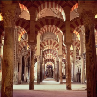 Interior view with columns of marble, jasper and granite in the Mosque of Cordoba.