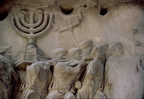 Basrelief in the Arch of Titus representing men carrying a menorah, located in the Via Sacra of t?