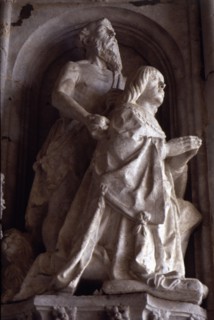 Praying statue of Don Manuel in the façade of the Jeronimos Monastery in Lisbon.