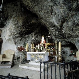 Interior of the Holy Cave of Covadonga with the image of the Virgin.