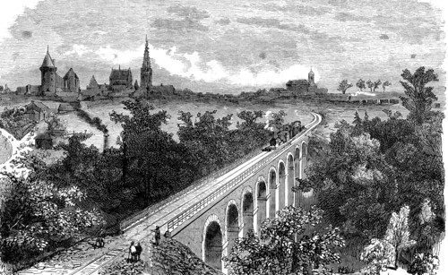 Railway line from Vitré to Fougères. Pass of a steam train by the viaduct on the Vilaine near Vit?