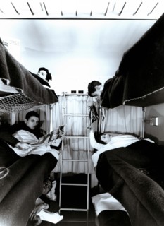 Interior of a traveler car wagon with bunks, 1950.
