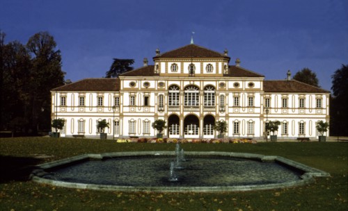View of the exterior of the building and gardens of the Treasury Villa.