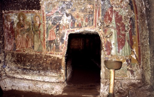 Detail of the interior of the sanctum of Mitreo and the mural paintings subsequently painted on t?
