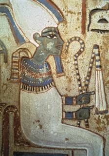 Funerary stela representing god Osiris, made in polychromed limestone. From Thebes.