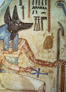 Detail of god Anubis in a familiar stela from a chapel of worship.