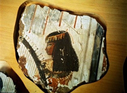 Fragment of a fresco from Thebes, showing a woman playing the harp.